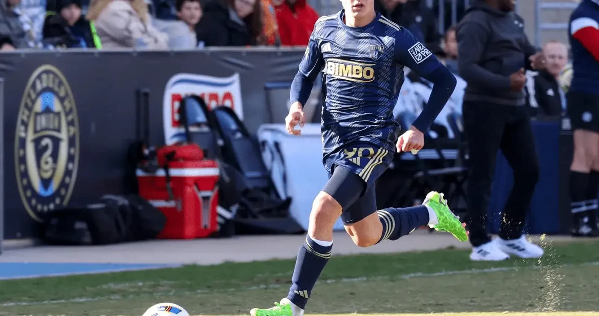Player running with ball during match
