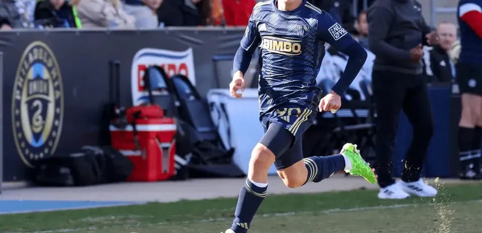 Player running with ball during match