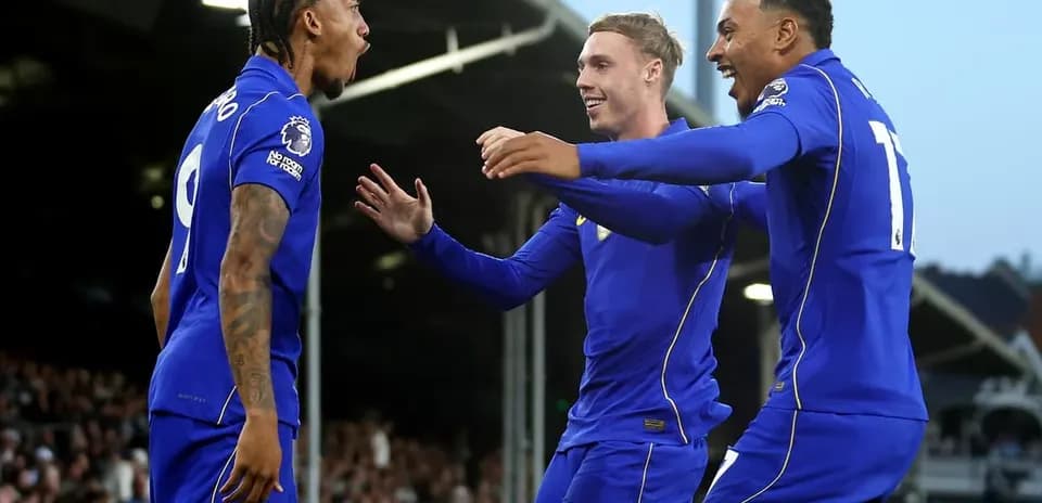 Players celebrating a goal during a match