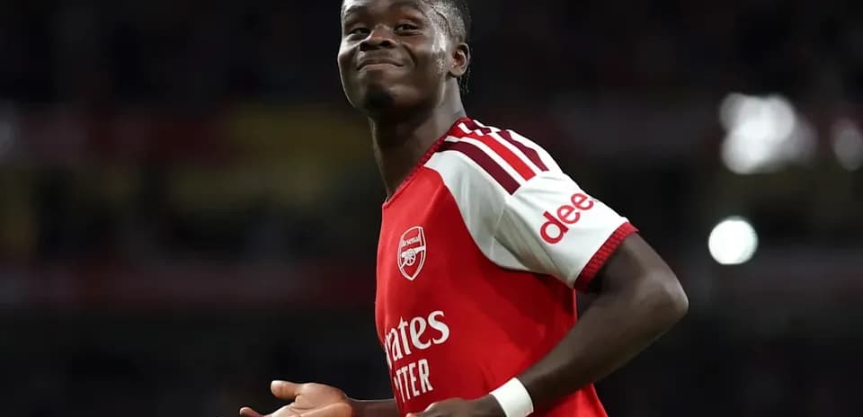 Player celebrating during a match in Arsenal kit