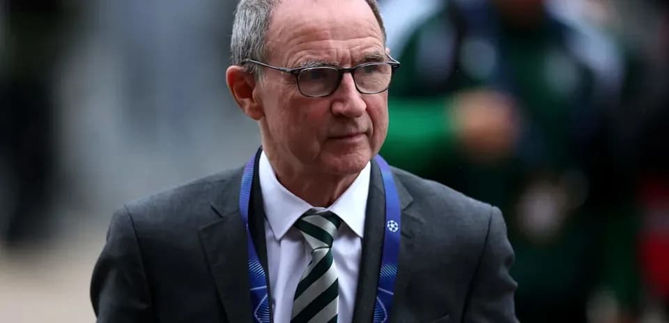 Manager walking with UEFA Champions League lanyard