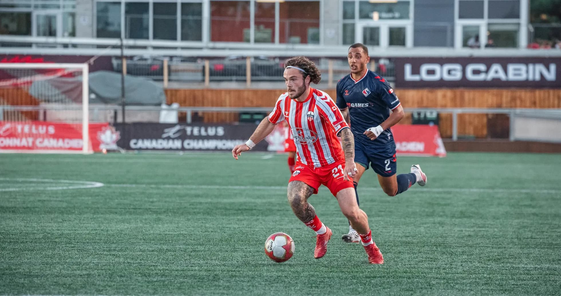 Player sprinting with ball during match