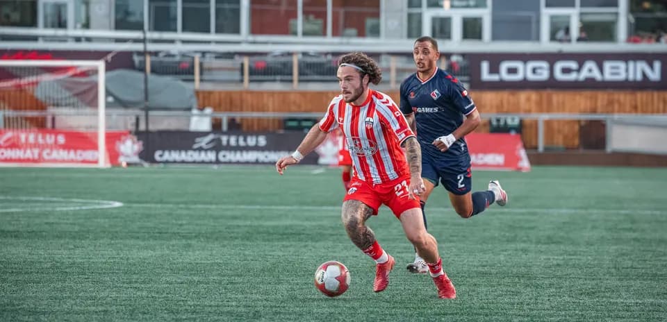 Player sprinting with ball during match