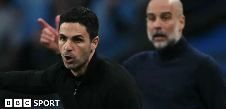 Two football managers on the sidelines during match