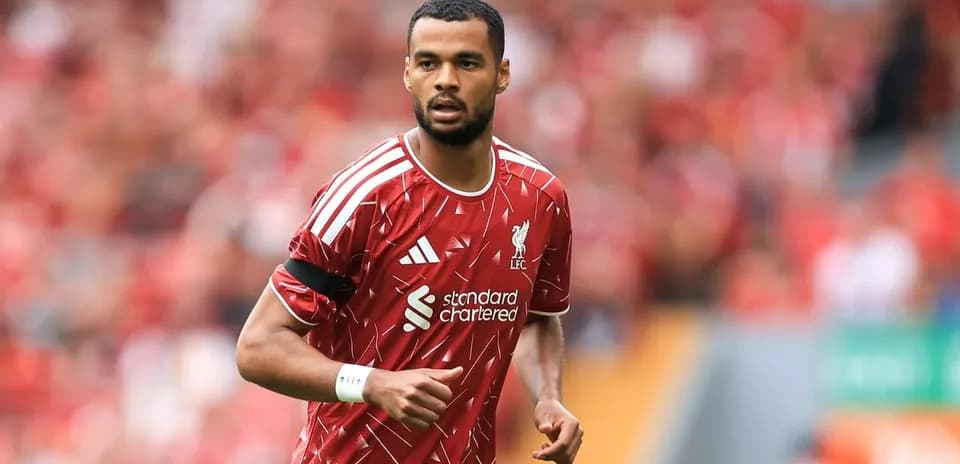 Player in Liverpool kit running on the pitch