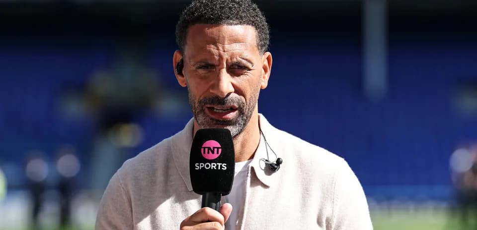 Sports analyst speaking into microphone on set