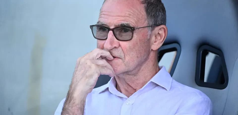 Man in glasses deep in thought during match