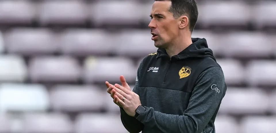 Coach instructing players on the sidelines