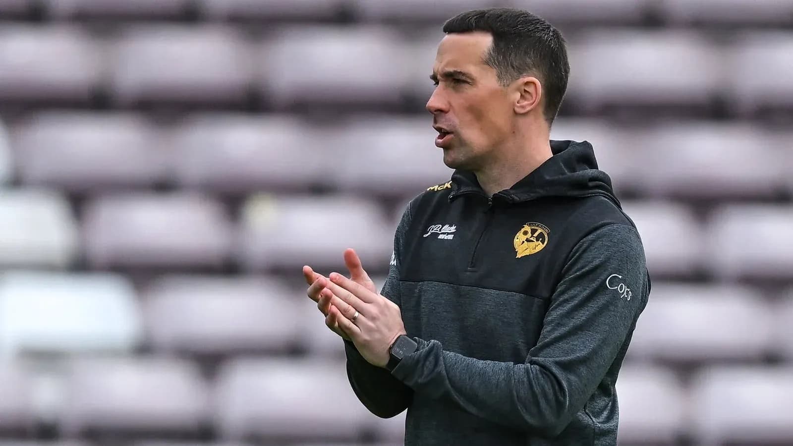 Coach instructing players on the sidelines