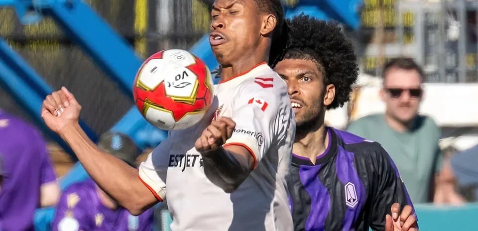 Player challenging for the ball during match