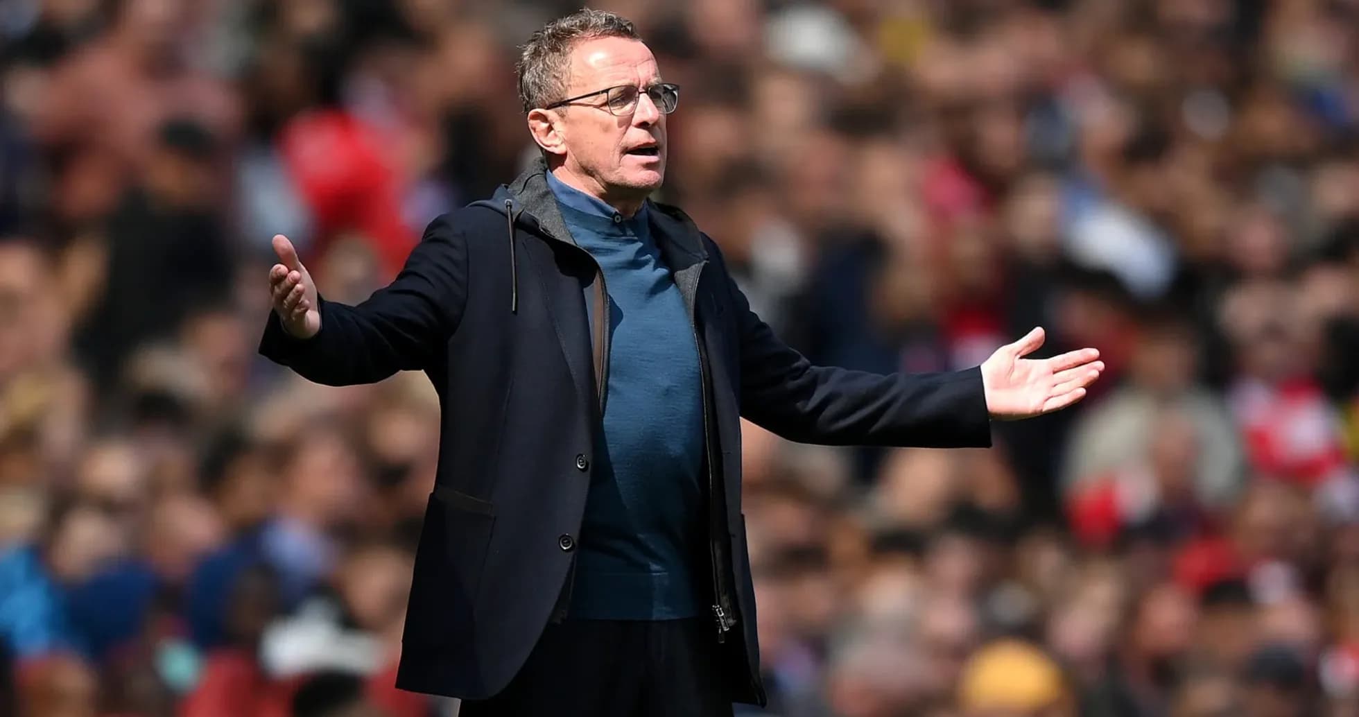 Coach gesturing during a match on the sidelines