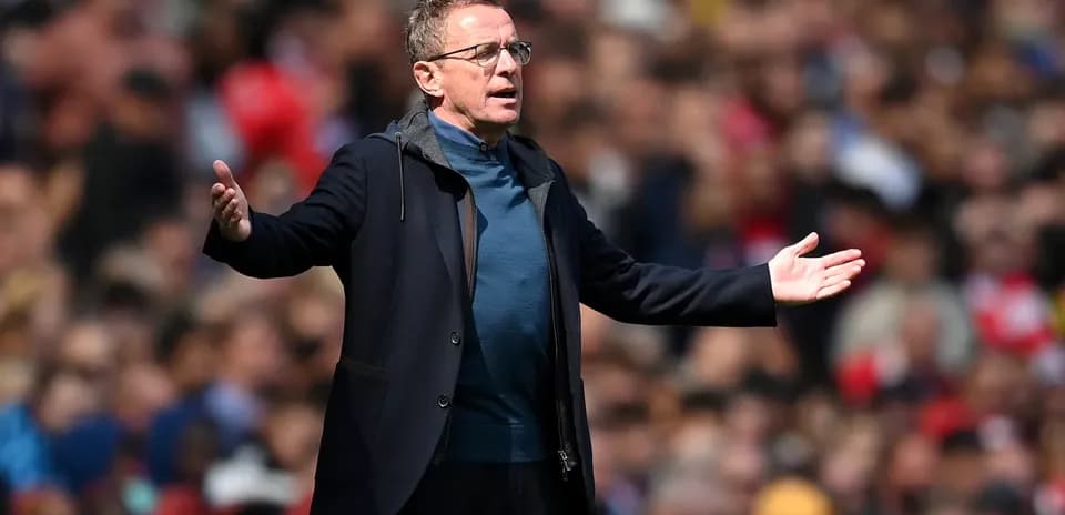 Coach gesturing during a match on the sidelines
