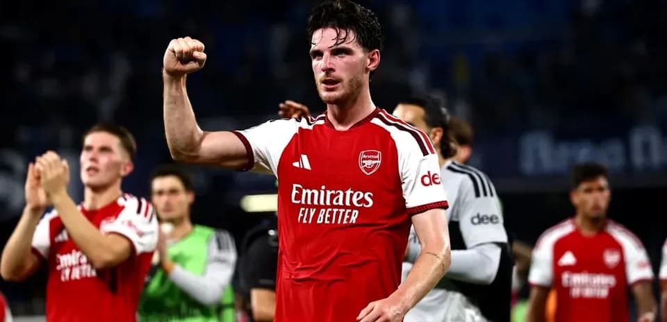 Arsenal player celebrating victory with raised fist