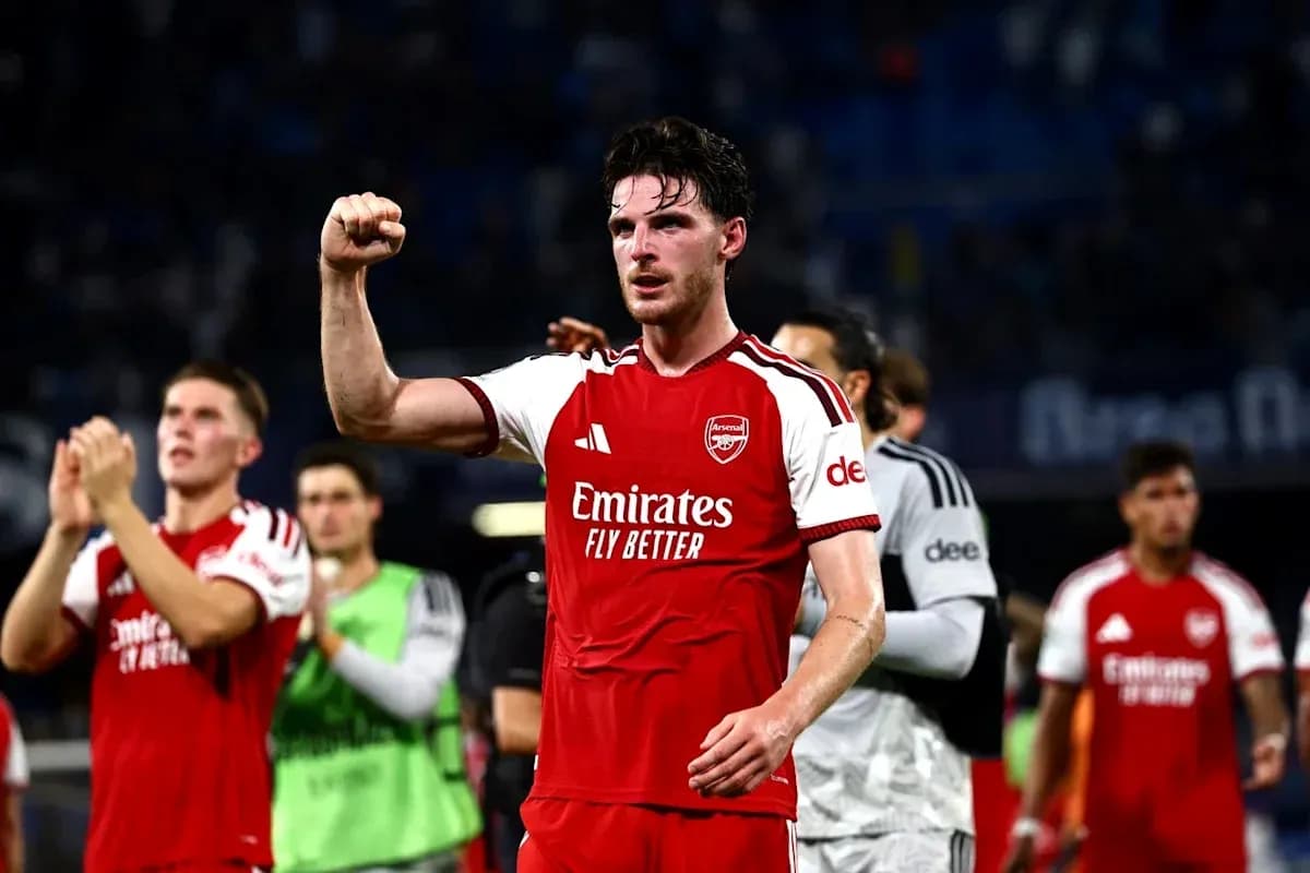 Arsenal player celebrating victory with raised fist