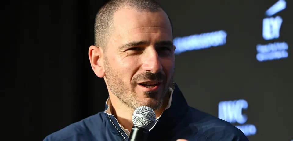 Speaker holding a microphone at a press event