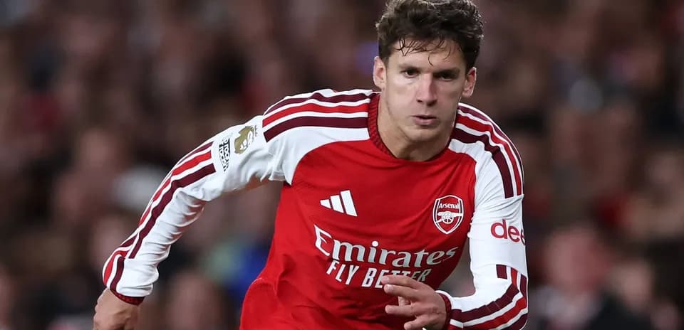 Player running during match in Arsenal kit