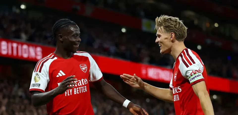 Arsenal players celebrating a goal during match