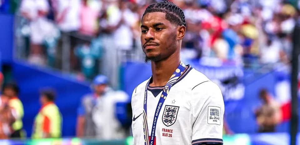 Player wearing England jersey walking on the pitch