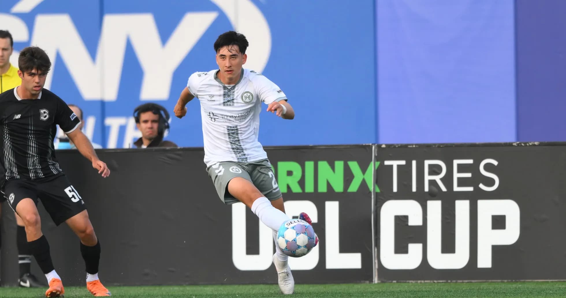 Player dribbling during NY Cosmos match