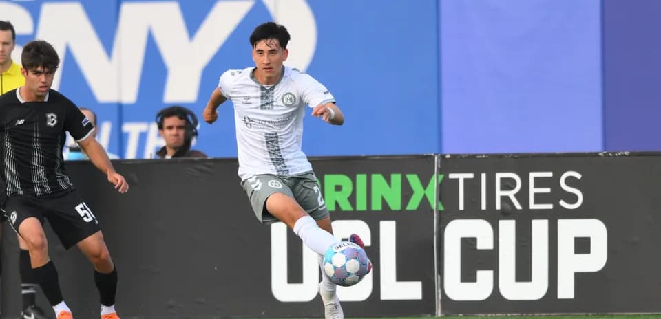 Player dribbling during NY Cosmos match