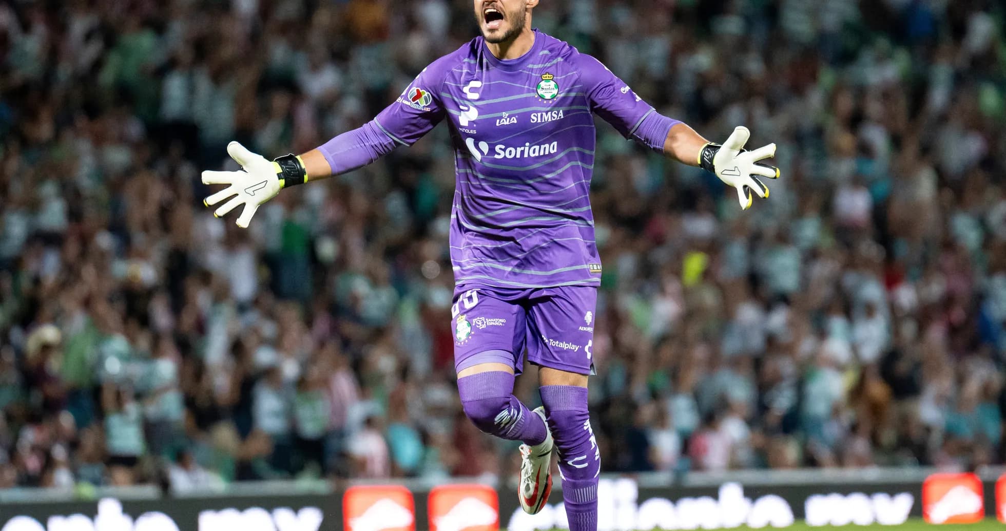 Goalkeeper celebrating during Liga MX match