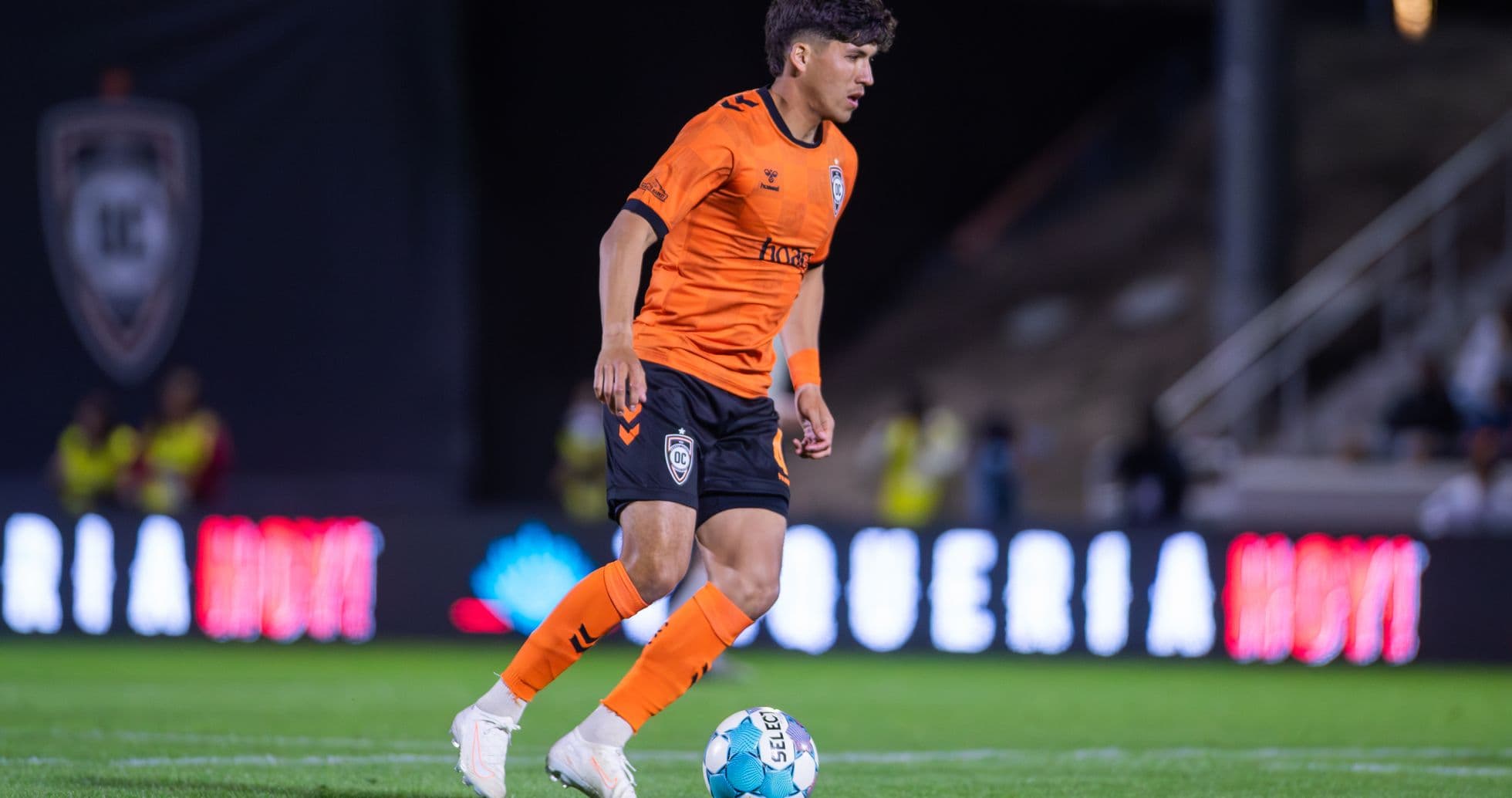 Player dribbling the ball for Orange County SC