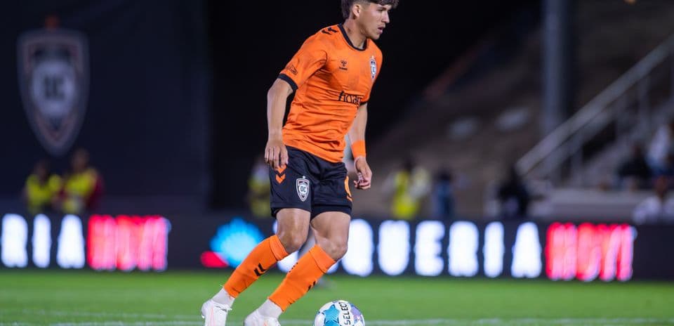 Player dribbling the ball for Orange County SC