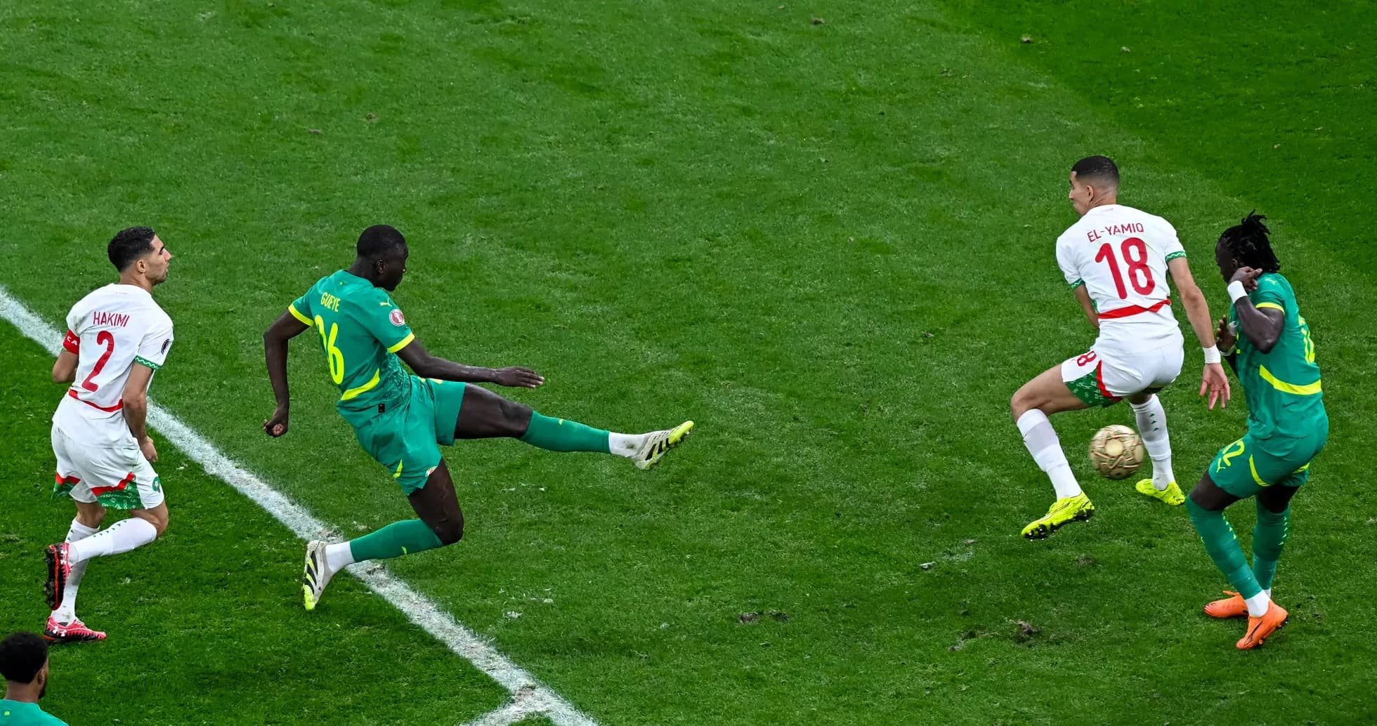 Players contesting the ball during a soccer match
