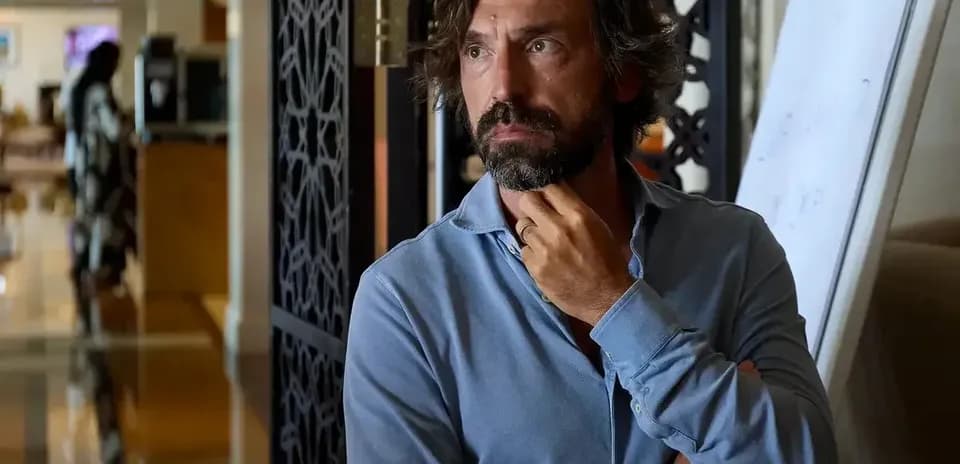 Man in a blue shirt thinking in an office