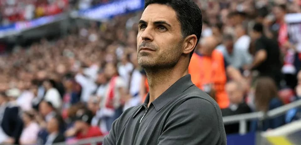 Coach observing match from the sidelines