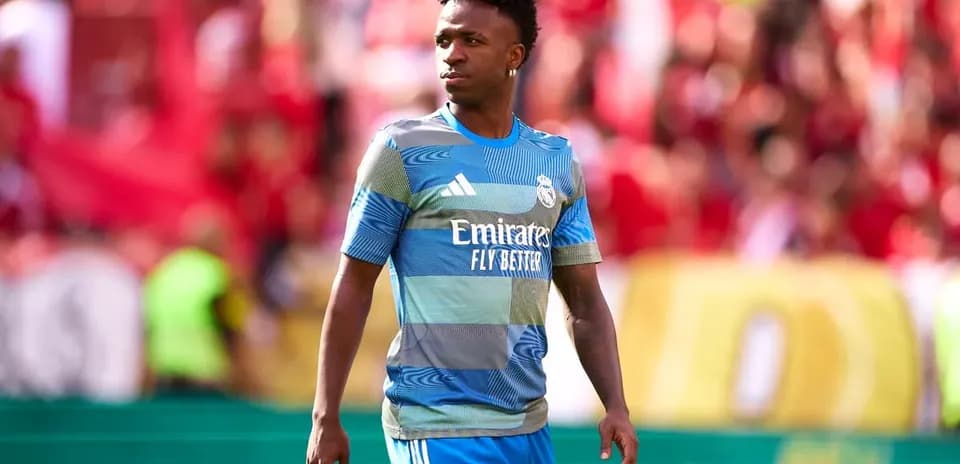 Player in Real Madrid kit walking on field