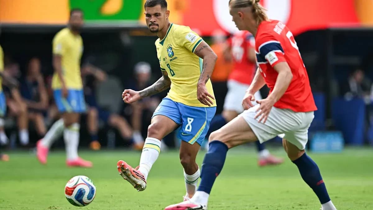 Brazil player dribbling past Norway defender during match
