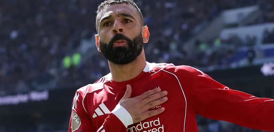 Player celebrating with hand on heart after scoring