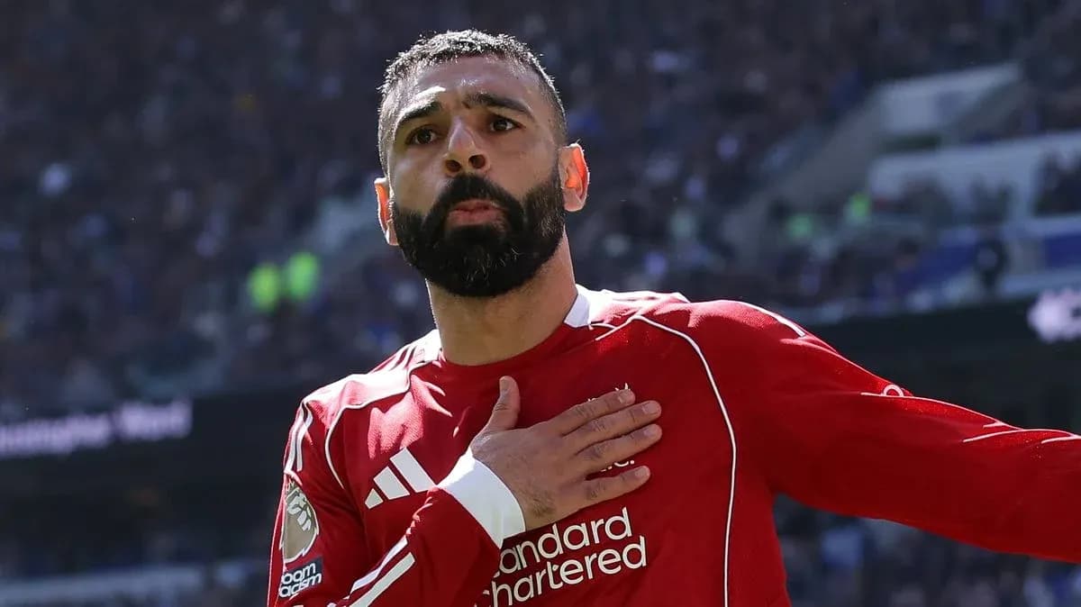 Player celebrating with hand on heart after scoring