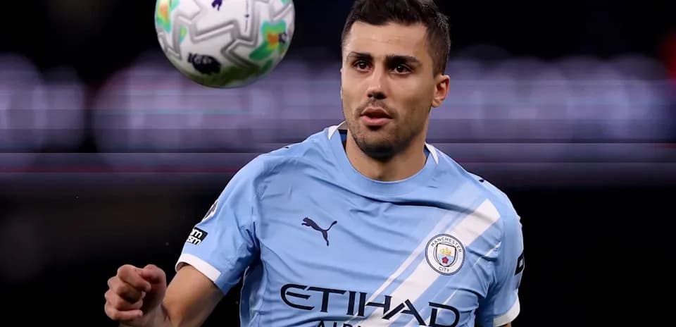 Player in light blue kit controlling a soccer ball