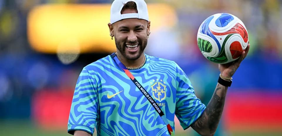 Player holding a soccer ball on the field