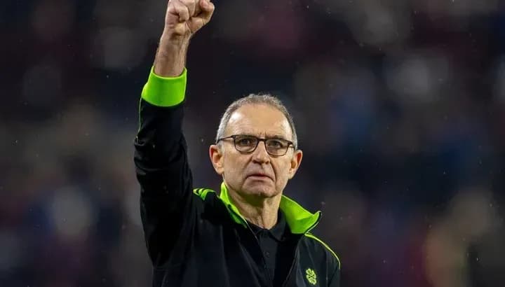 Manager celebrating with raised fist at stadium