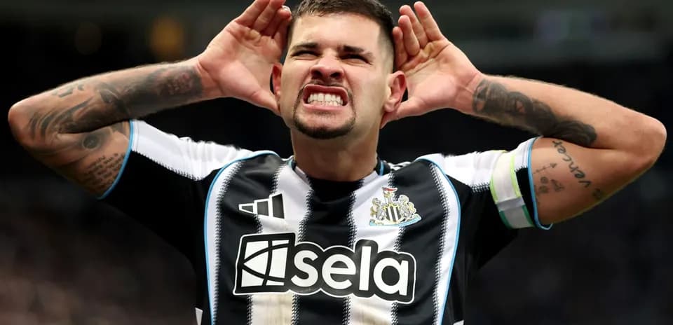 Player celebrating with hands on head at stadium