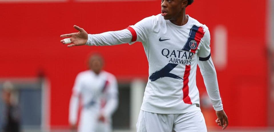 Player gesturing during a match in PSG uniform