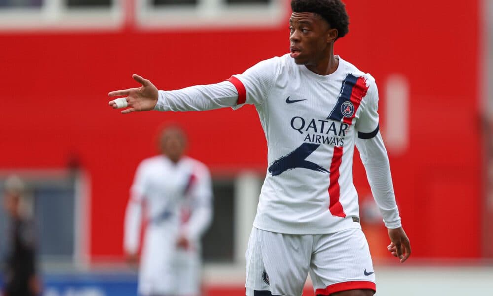 Player gesturing during a match in PSG uniform