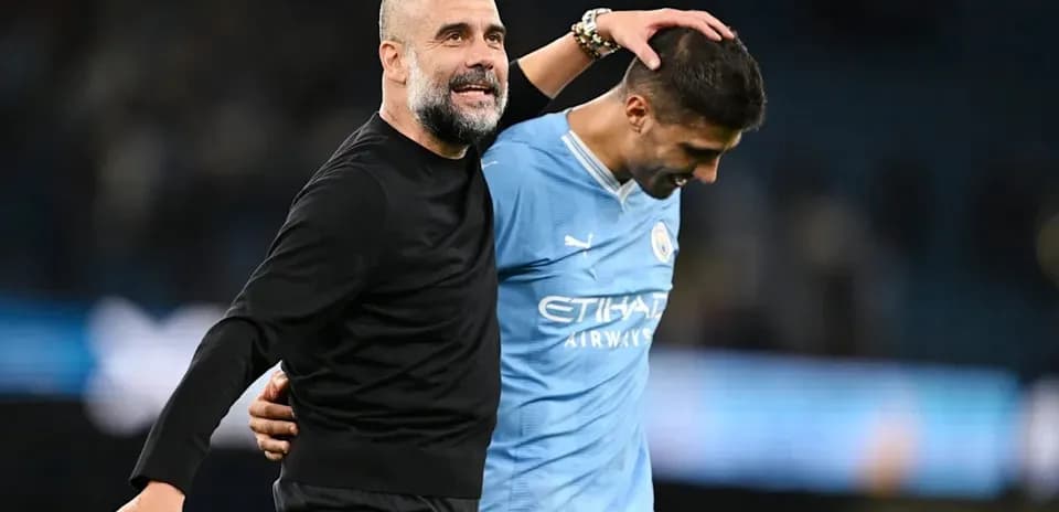 Coach and player celebrating after a match