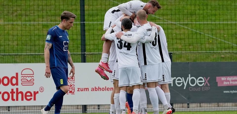 Players celebrating a goal during Oberliga match