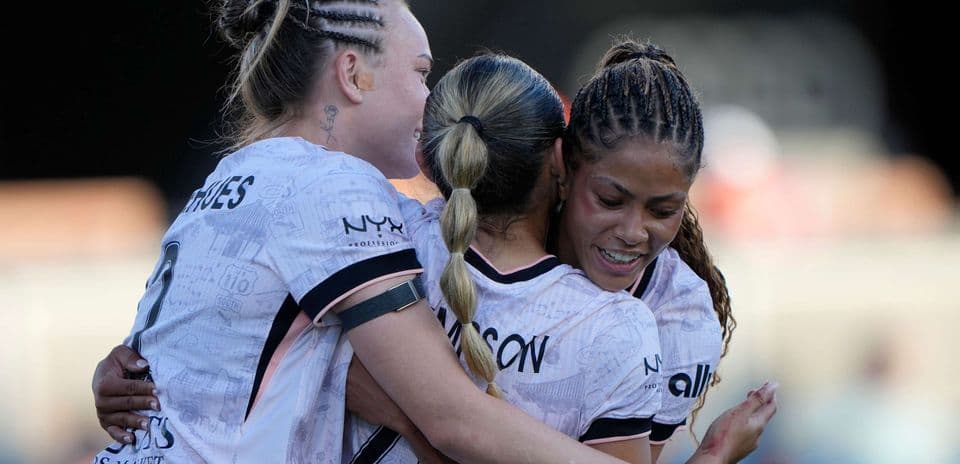 Players celebrating during Angel City W match