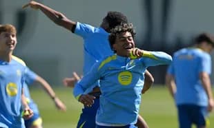Players celebrating during training session outdoors