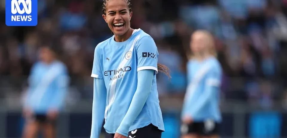 Player smiling during Manchester City match