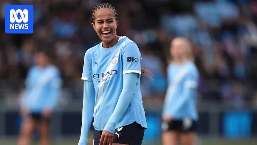 Player smiling during Manchester City match