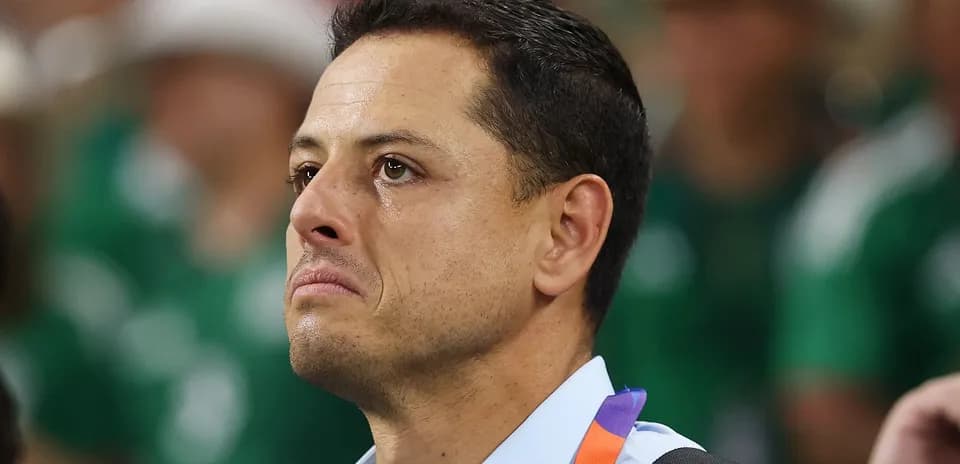 Man with tearful expression in sports venue