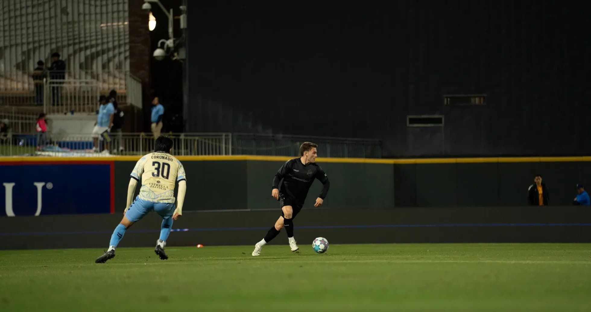 Player dribbling the ball during Colorado Springs match