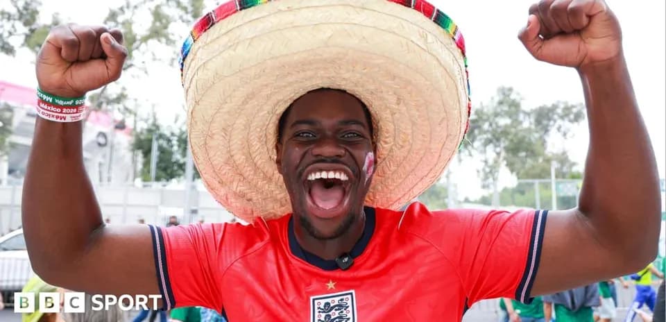 Fan wearing sombrero celebrating at football event