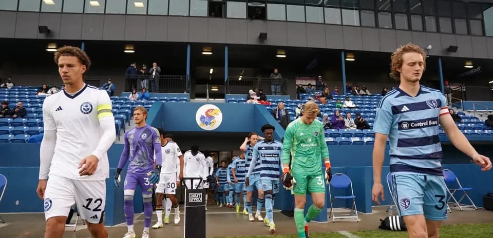Players walking onto the field for match
